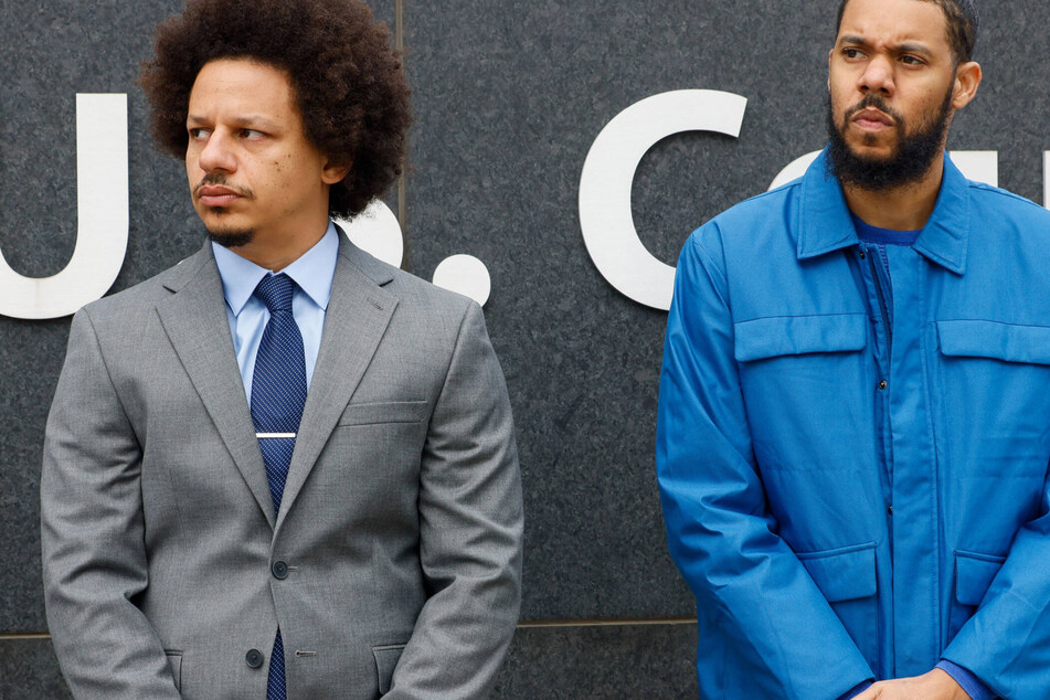 Eric André (l.) and Clayton English (r.) attend a press conference in front of the Richard B. Russell federal courthouse in Atlanta on Tuesday.