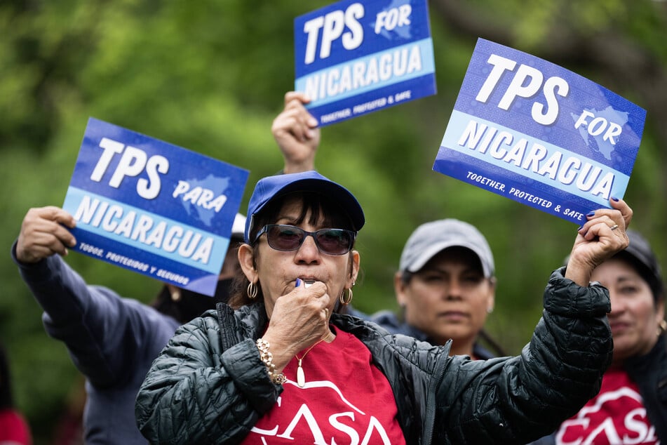 Demonstrators rally in Washington DC's Lafayette Park to demand Temporary Protected Status for Nicaragua, Honduras, Guatemala, and El Salvador.