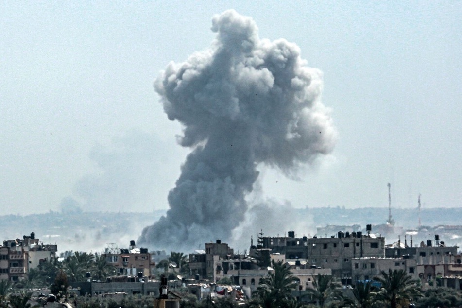 A smoke plume billows following Israeli bombardment north of Nuseirat in the central Gaza Strip on April 23, 2024.