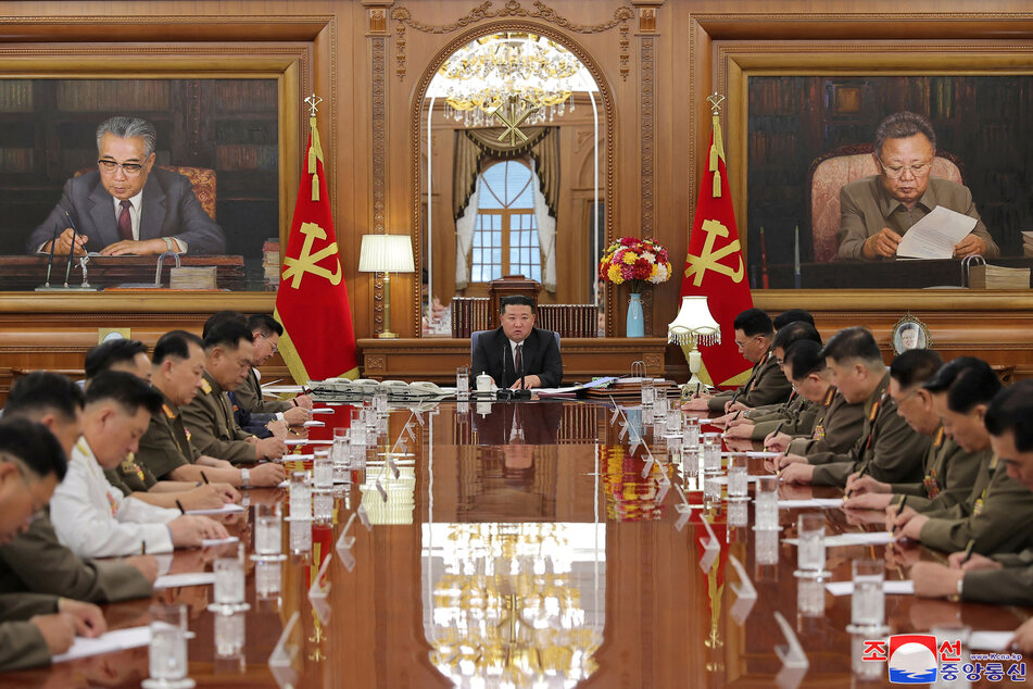 North Korea responded furiously to UN criticism of the regime led by Jim Jong-un (c.), calling defectors "human scum."