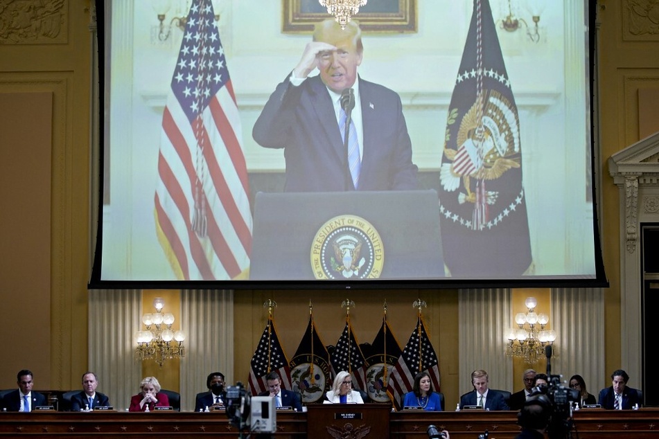 A video of former President Donald Trump recording an address to the nation on January 7, 2021, is displayed on a screen during a January 6th Committee hearing.