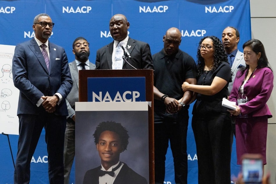Attorney Ben Crump and the parents of Nolan Wells speak at the annual NAACP National Convention to announce the results of an independent autopsy of Wells on July 22, 2026, in Chicago, Illinois.