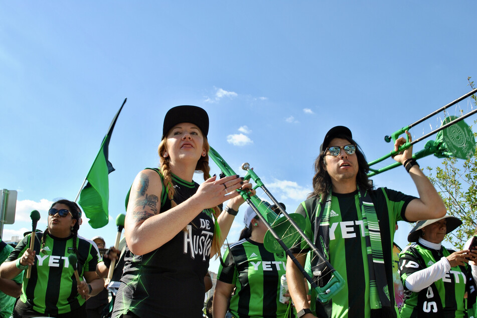 La Murga de Austin members wait to greet Austin FC players outside Q2 Stadium on June 19, 2021.