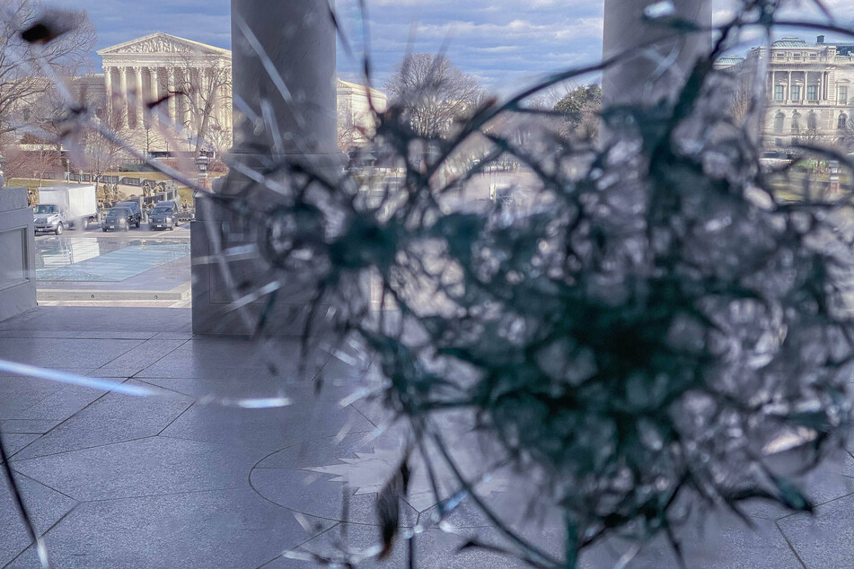 There are still shattered windows at the Capitol resulting from the January 6 attack.