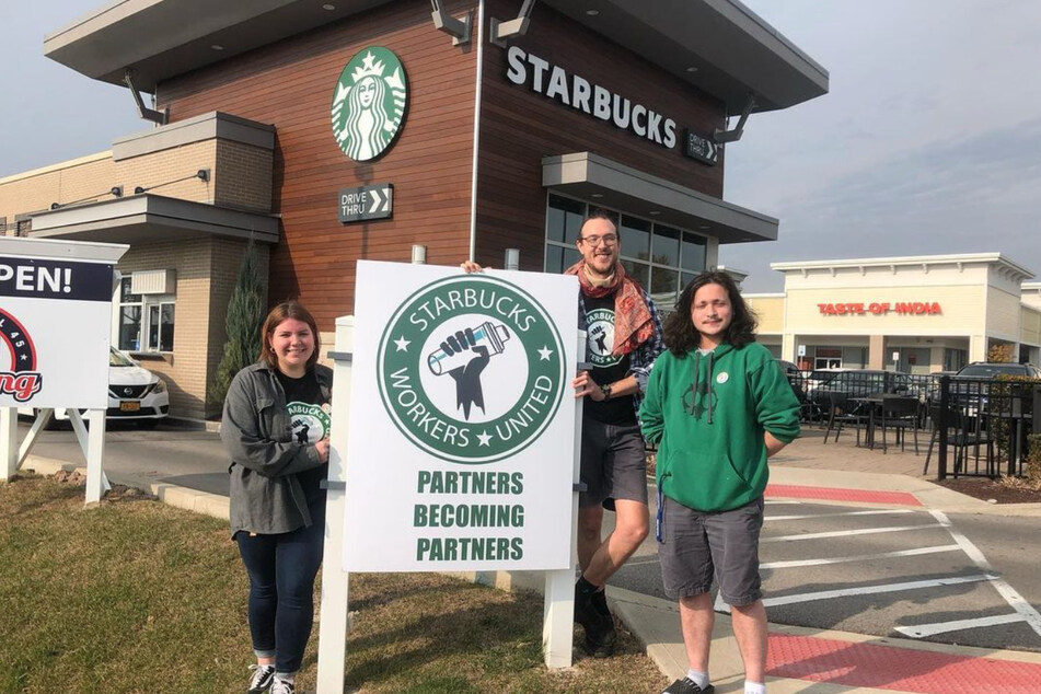James Skretta (c.) and his partners filed a petition with the NLRB to hold a union vote at their Buffalo Starbucks location.