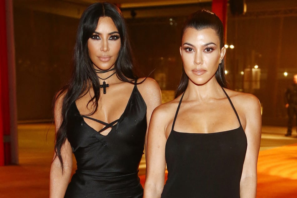 Kim Kardashian (l.) and Kourtney Kardashian (r.) oozed high fashion in their new SKIMS x Dolce &amp; Gabbana collaboration.