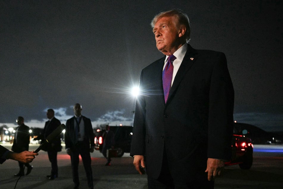 President Donald Trump speaks to journalists upon returning to Joint Base Andrews, Maryland, on March 11, 2026.