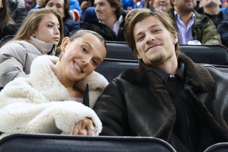 Millie Bobby Brown (l.) attended Thursday's New York Rangers game with her fiancé, Jake Bongiovi.