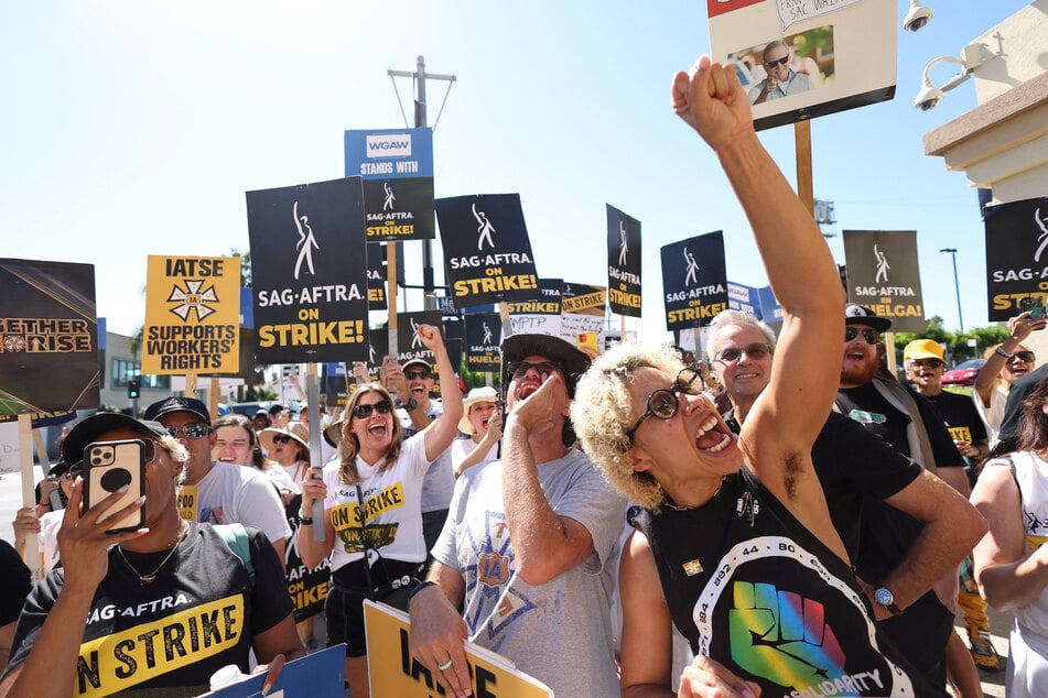SAG-AFTRA members walk the picket line outside Paramount Studios during their ongoing strike, in Los Angeles, California.
