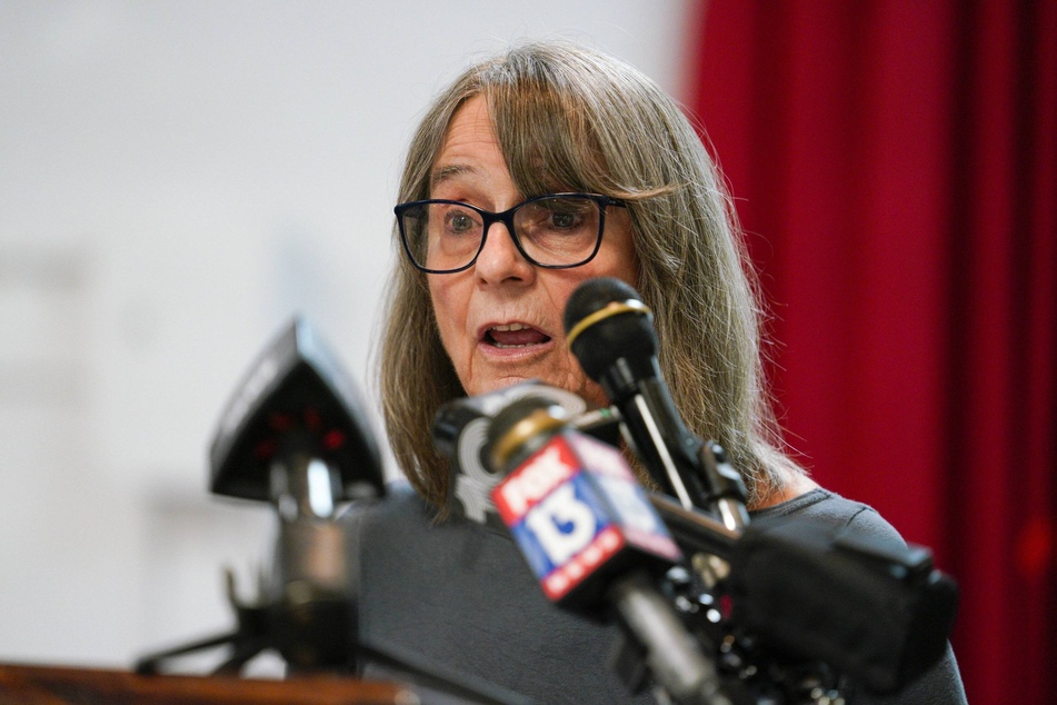 African People's Solidarity Committee Chair Penny Hess speaks to the media after being indicted on charges of allegedly working on behalf of the Russian government.