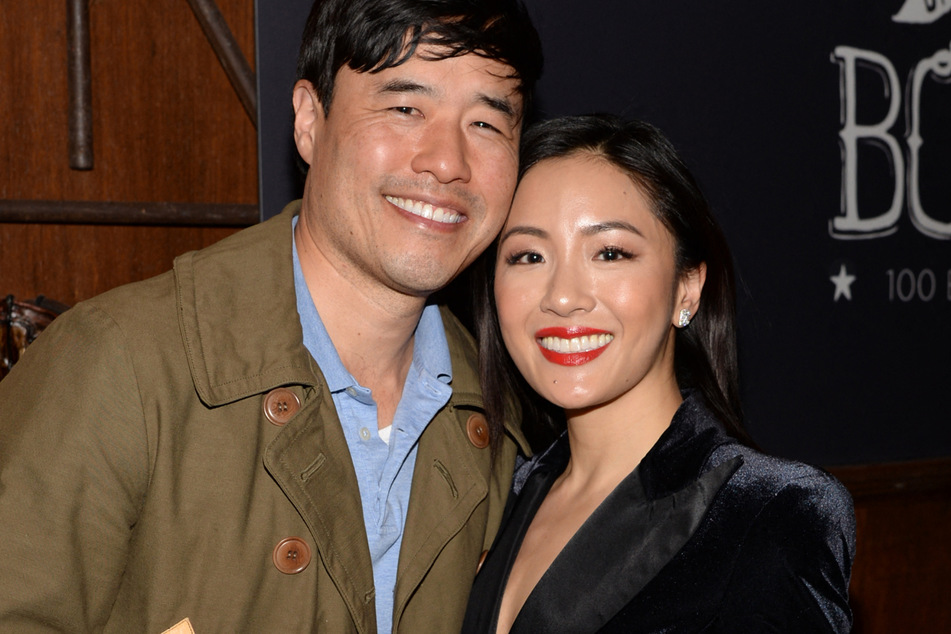 Randall Park (l) and Constance Wu attend Fresh Off the Boat's 100th episode celebration in 2019.