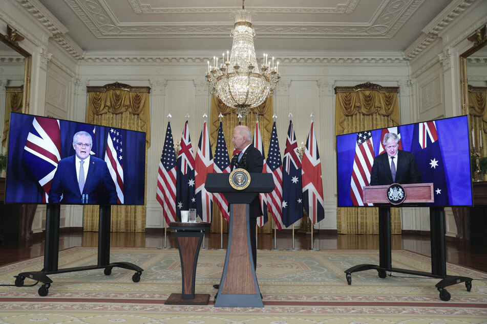 President Joe Biden (c.) announced the new AUKUS national security initiative on Wednesday at the White House, and was joined virtually by Prime Minister Scott Morrison of Australia (l.) and Prime Minister Boris Johnson of the UK (r.).