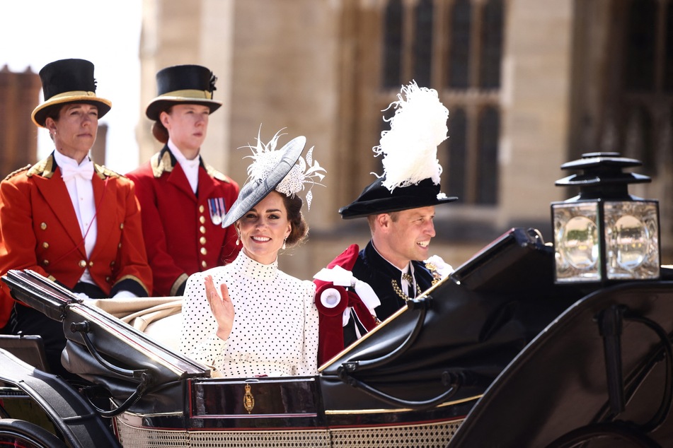 Britain's Catherine, Princess of Wales (l.) and Britain's Prince William, Prince of Wales (r.) leave in a horse-drawn carriage from St George's Chapel after attending the Most Noble Order of the Garter Ceremony in Windsor Castle in Windsor, on June 19, 2023.