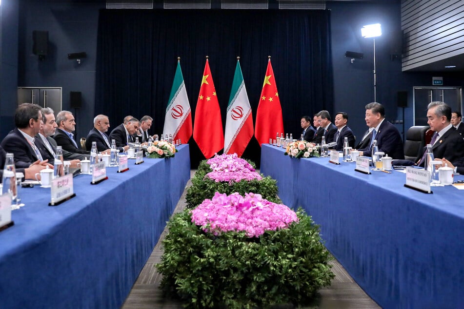 Chinese President Xi Jinping meets with Iranian President Masoud Pezeshkian during a BRICS summit in October, 2024.