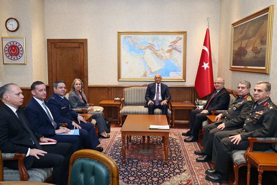 Turkey's Defense Minister Yasar Guler (third from r.), US envoy Tom Barrack (c.) and their delegations are pictured during a meeting in Ankara on January 16, 2026.