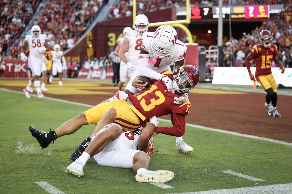Caleb Williams' (r.) future in college football seems uncertain as the possibility of a second Heisman Trophy win fades and USC's playoff hopes are dashed.