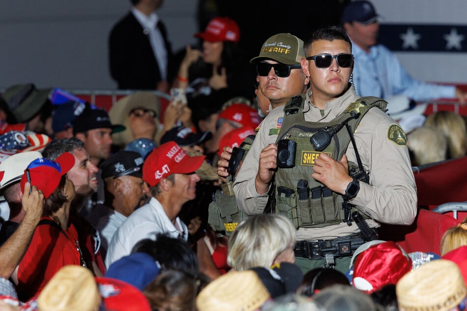 Riverside Country officers keep watch during a Donald Trump rally in Coachella, California.