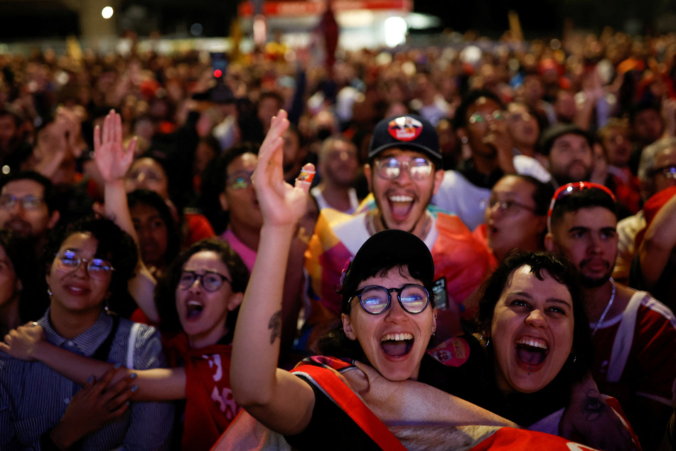 Lula supporters celebrate on Sunday after polling stations close in the presidential election.