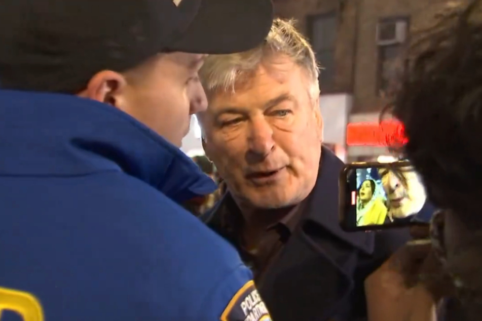 Alec Baldwin was escorted away from the protest by members of the NYPD.