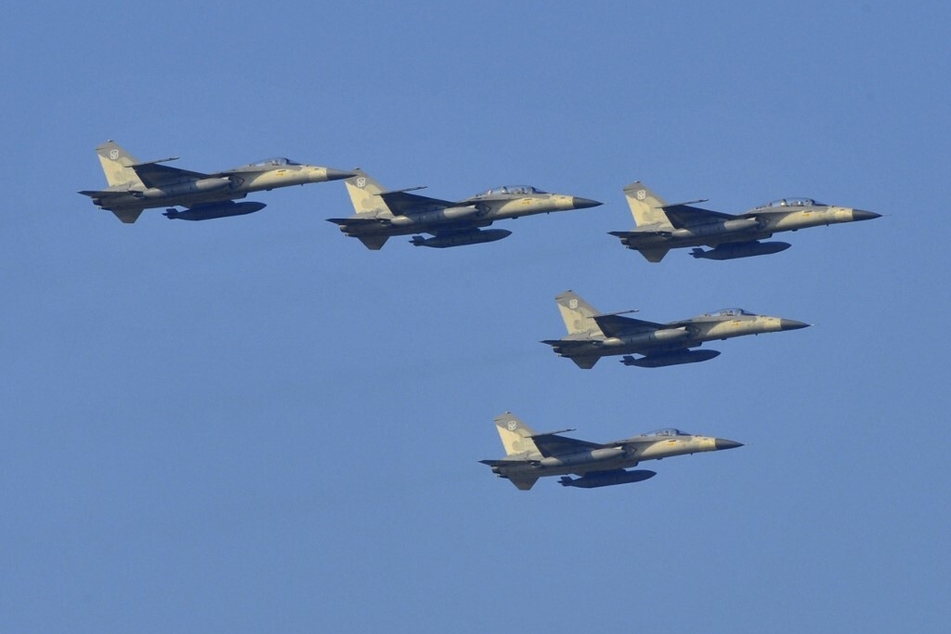 Fighter jets fly during a combat skills demonstration at a military base in Taiwan.