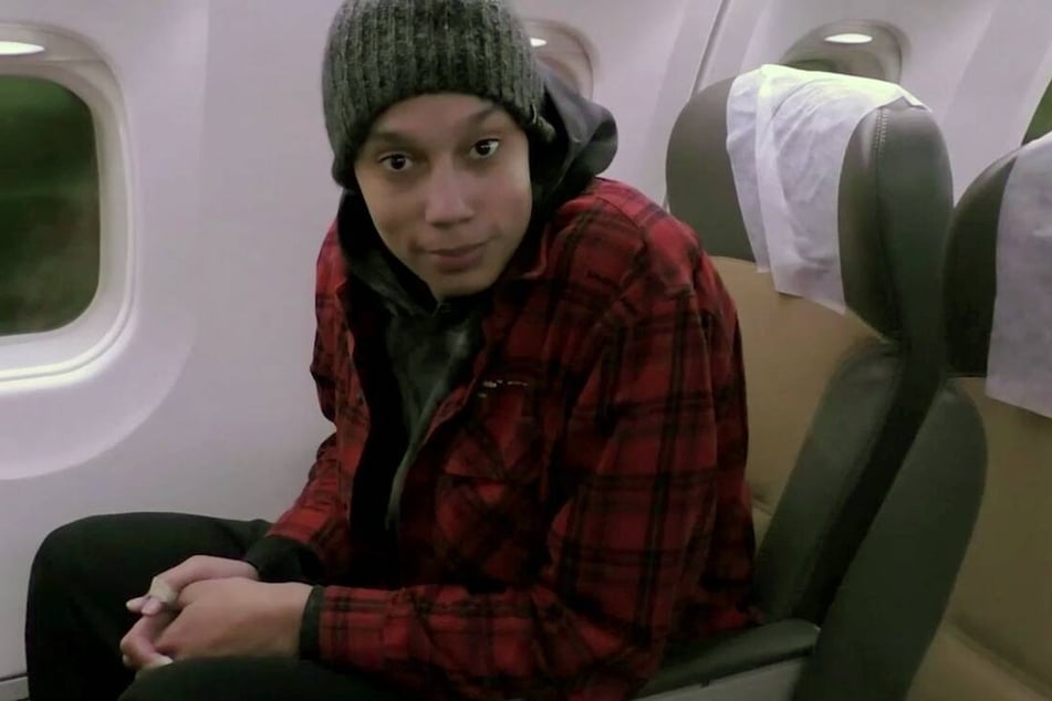 Brittney Griner aboard the plane ahead of her departure back to the US.