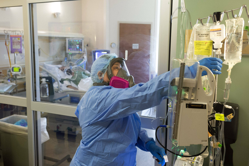 Fullerton, California on February 15, 2021: Nurse Celina Monde tends to a patient who is fighting Covid-19.