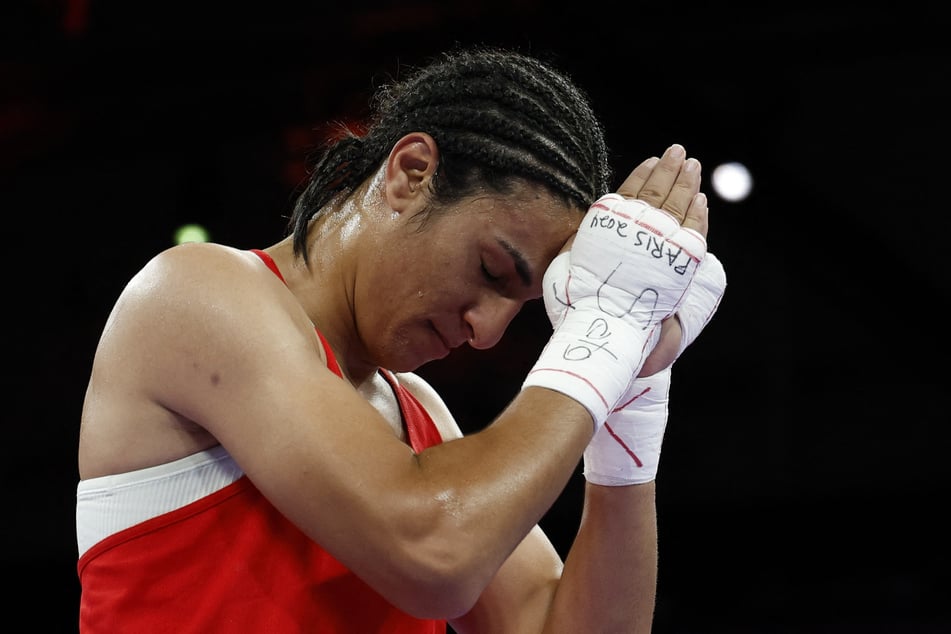 Imane Khelif of Algeria reacts after securing a spot in the Paris Olympics women's boxing 66kg semi-finals.