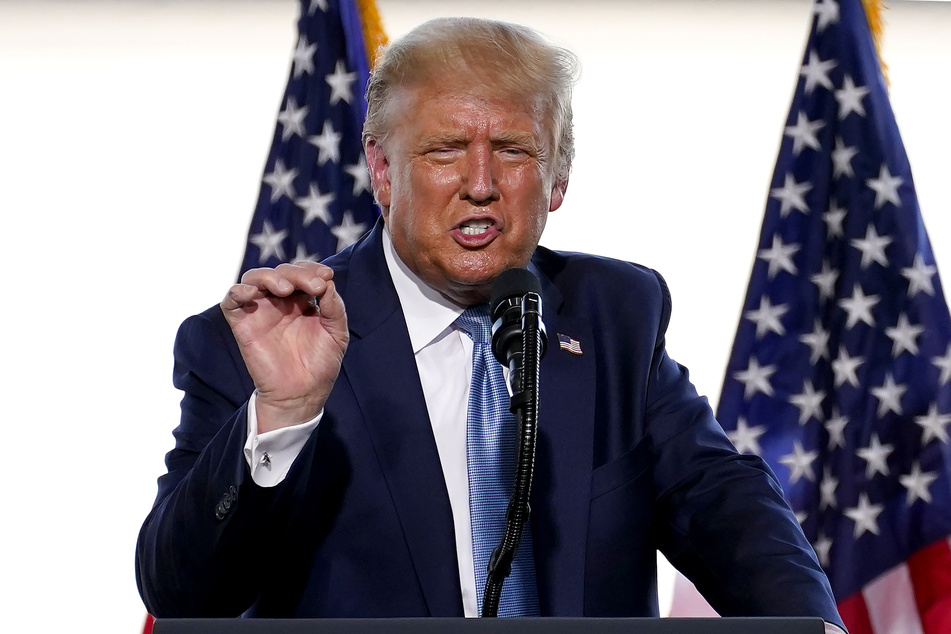 Donald Trump (74), president of the USA, speaks to his supporters during an election campaign event at Yuma International Airport.