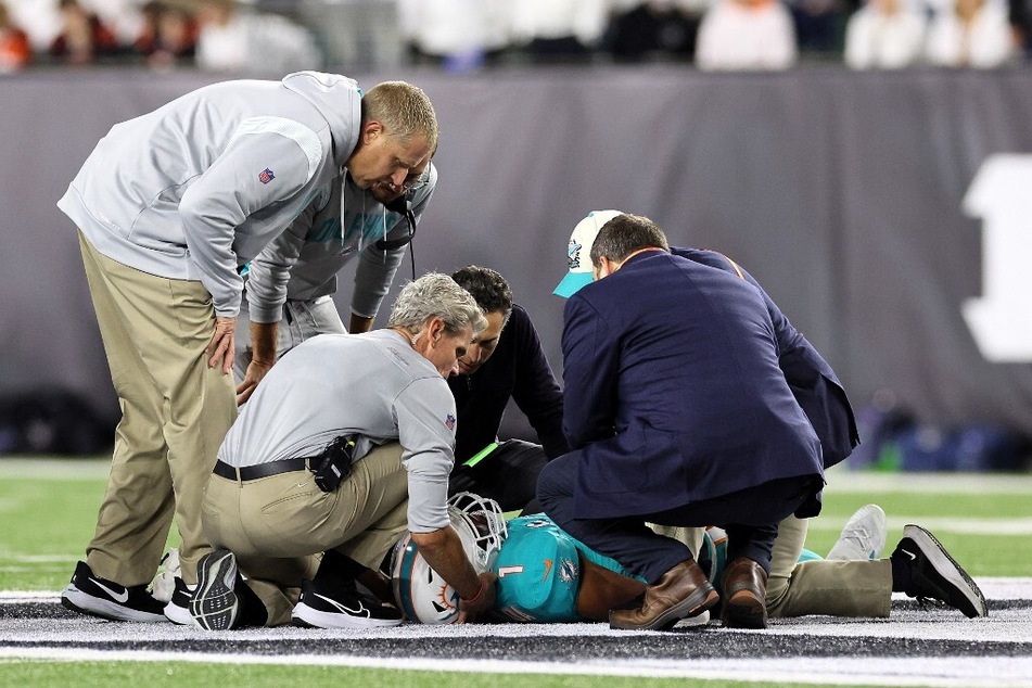 Medical staff tend to quarterback Tua Tagovailoa of the Miami Dolphins after an injury during the second quarter of the game against the Cincinnati Bengals at Paycor Stadium.