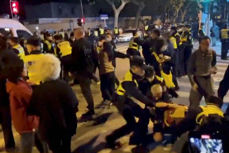 Police crack down on protesters in Shanghai.