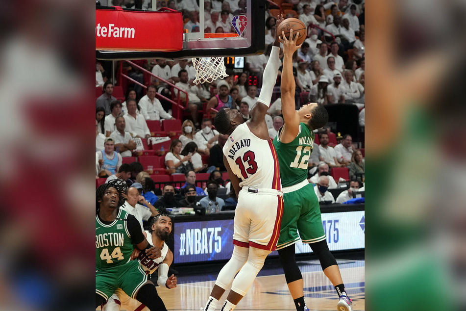 Bam Adebayo (c.) helped the Heat equal the franchise record for blocks in a playoff game.