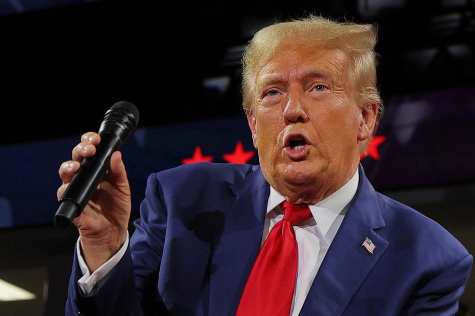 Republican presidential nominee Donald Trump holds a campaign town hall meeting, moderated by Arkansas Governor Sarah Huckabee Sanders, in Flint, Michigan.