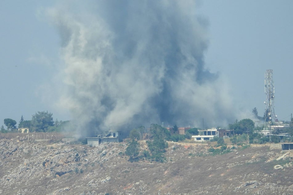 A plume of smoke rises over the town of Kfar Tebnit in southern Lebanon following an Israeli airstrike carried out despite a ceasefire agreement in Nabatieh, Lebanon, on June 1, 2026.