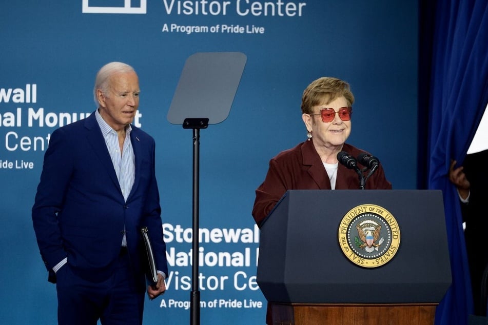 Elton John (r.) and President Joe Biden speak onstage during the Grand Opening Ceremony for the Stonewall National Monument Visitor Center on June 28, 2024, in New York City.