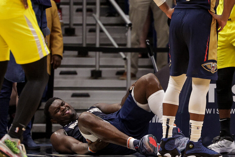 New Orleans Pelicans forward Zion Williamson is injured on a play by a Utah Jazz player during the second half at Smoothie King Center.