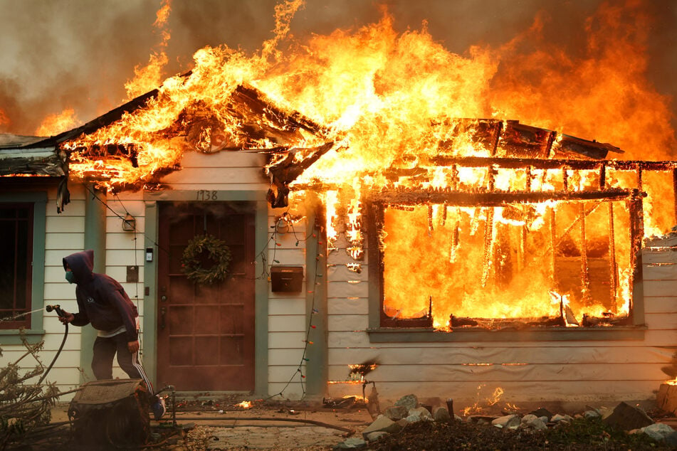 Hydrants run dry as Los Angeles wildfires kill two and destroy hundreds of homes