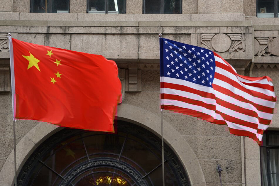 The US State Department has fired an employee who did not acknowledge a romantic relationship with a Chinese national.