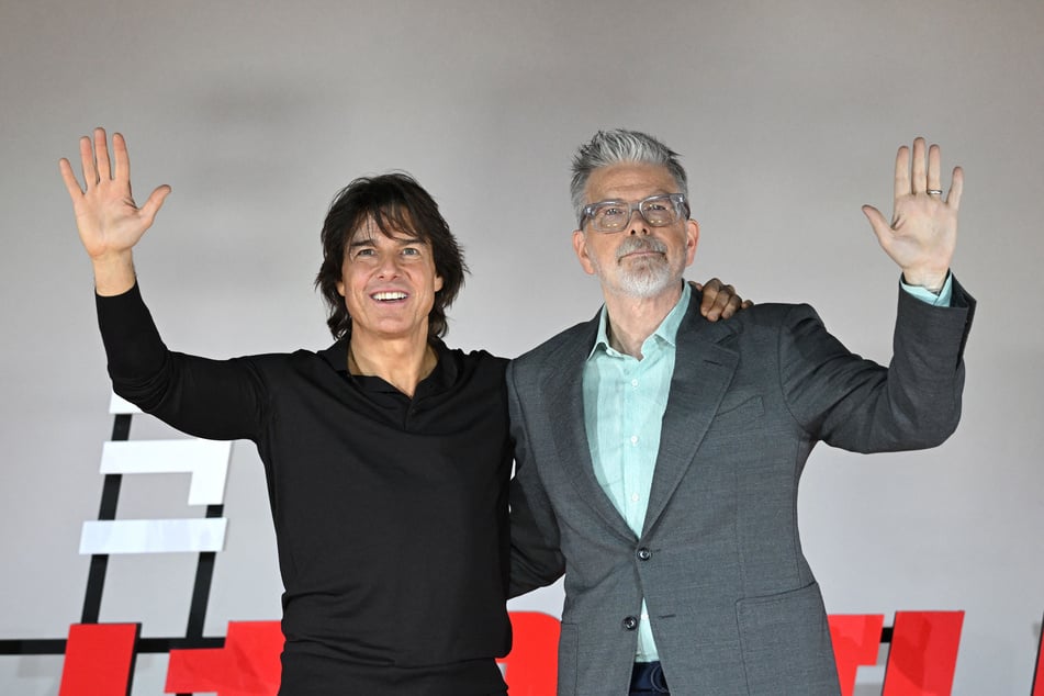 Tom Cruise (l.) and film director Christopher McQuarrie pose for a photo session during a press conference for the film "Mission: Impossible – The Final Reckoning" in Seoul on May 8, 2025.