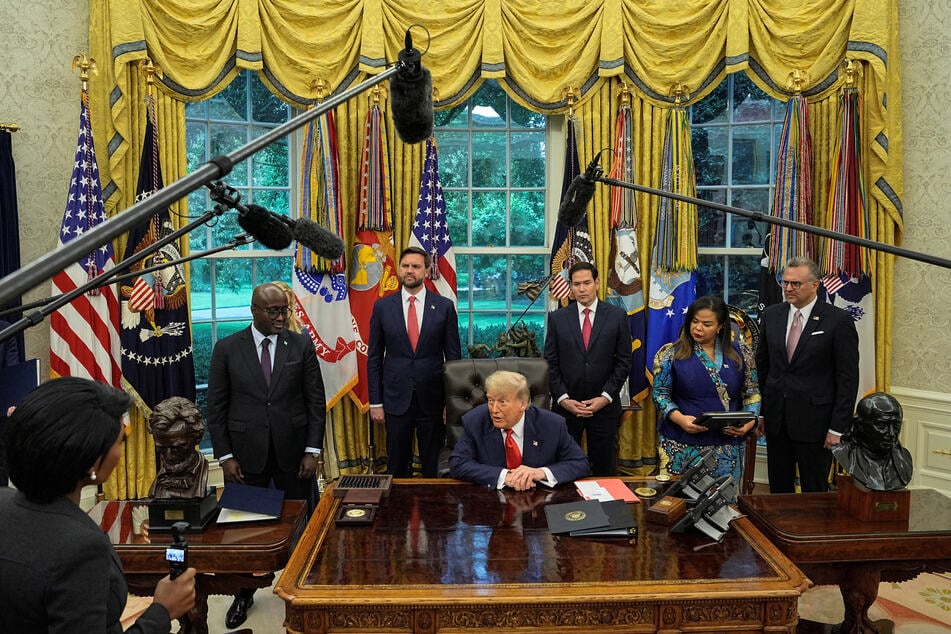 President Donald Trump (c.) speaks during a meeting with the Democratic Republic of the Congo's Foreign Minister Therese Kayikwamba Wagner and Rwanda's Foreign Minister Olivier Nduhungirehe in the Oval Office of the White House on June 27, 2025.