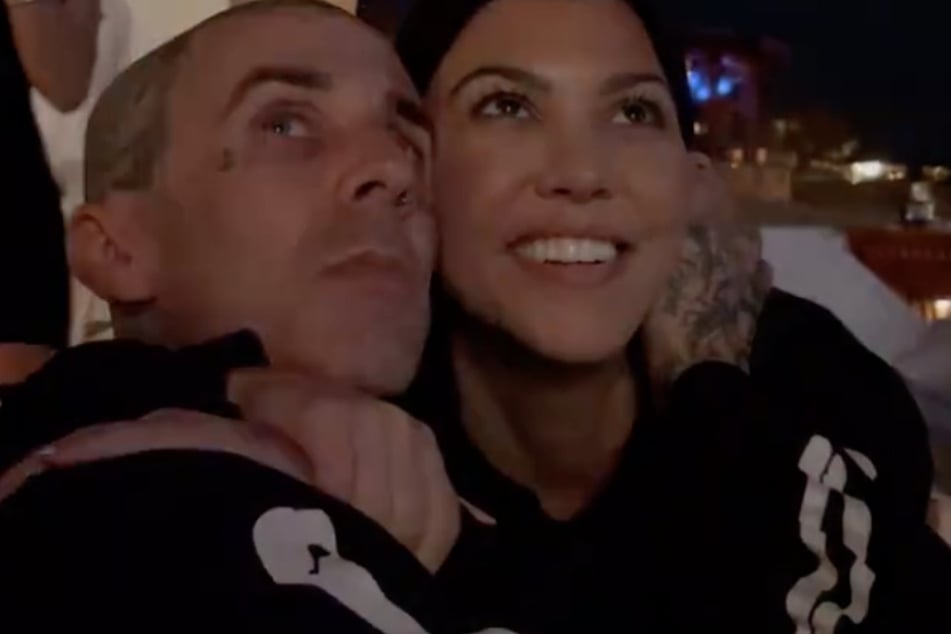 Kourtney Kardashian and Travis Barker were all smiles while enjoying a fireworks show in Cabo, Mexico.