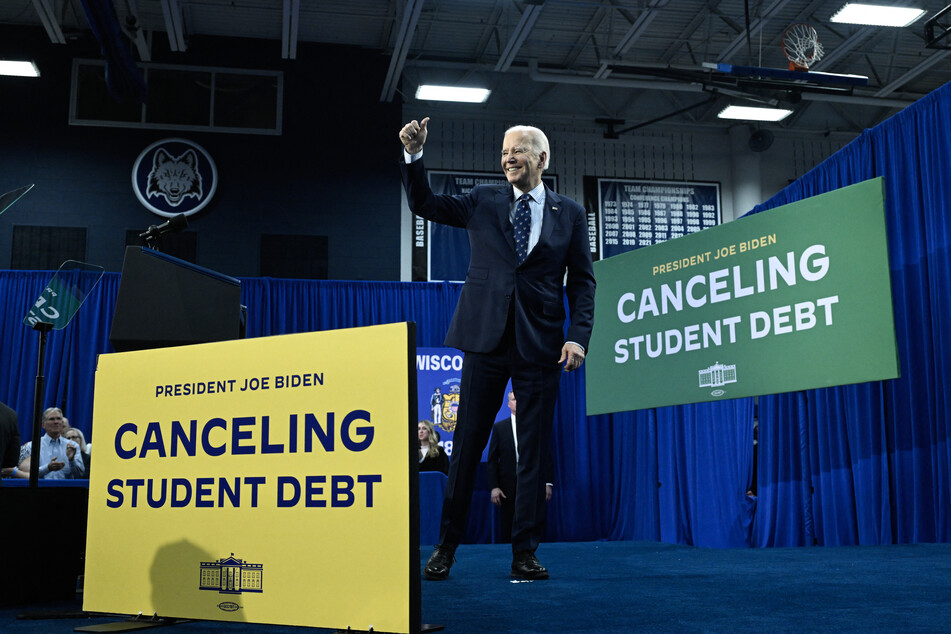 President Joe Biden smiles for the crowd after speaking about student loan debt relief at Madison Area Technical College in Madison, Wisconsin on Monday.