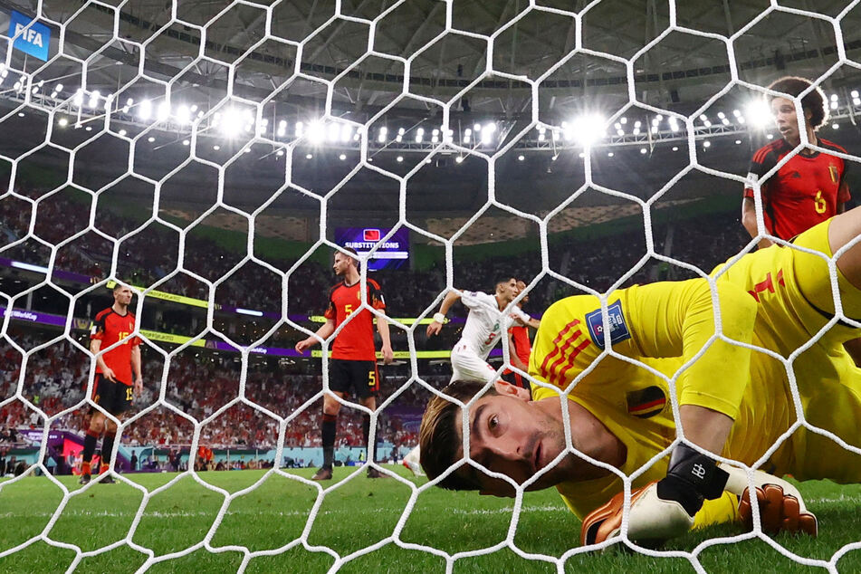 Belgium's Thibaut Courtois looks dejected after Morocco's Abdelhamid Sabiri scored their first goal.