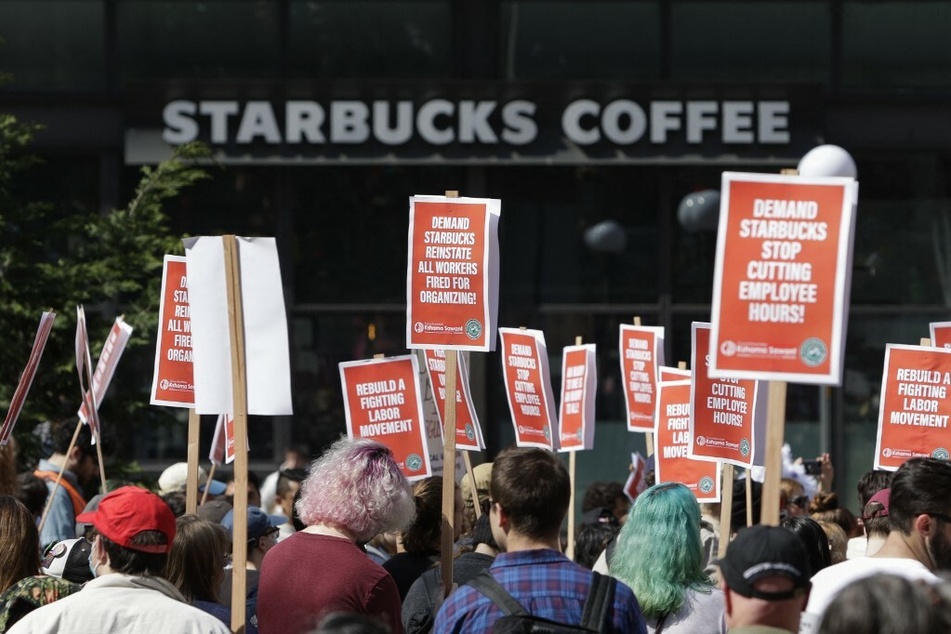 Starbucks workers and allies demand an end to corporate union-busting at a rally in the coffee chain's hometown of Seattle, Washington.