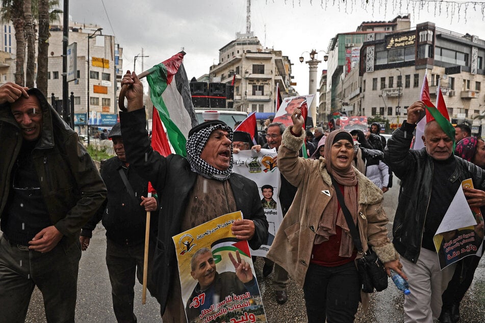 People protest in the occoupied West Bank city of Ramallah in support of Palestinian prisoners held in Israeli jails on February 27, 2024.