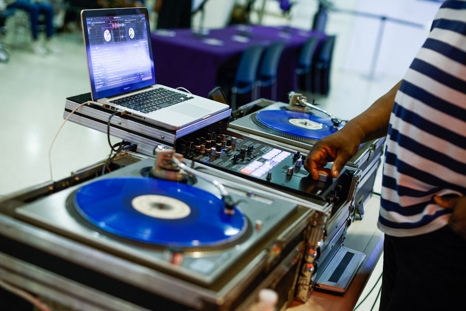DJ Chuck Chillout plays music after the official launch of the Special Edition Hip-Hop Library Card, in celebration of the 50th anniversary of hip-hop, at the Queens Public Library.