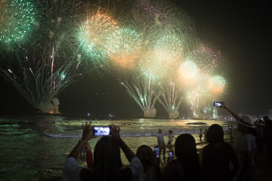 A 12-minute firework show took place off the shores of Copacabana Beach in Rio de Janeiro, Brazil.