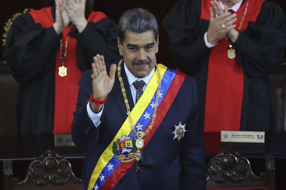 Venezuelan President Nicolas Maduro waves during the opening ceremony of the judicial year at the headquarters of the Supreme Court of Justice in Caracas on Friday.