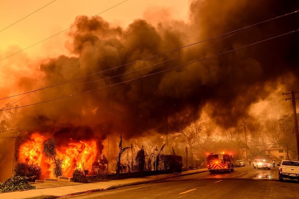 An apartment building burns during the Eaton fire in the Altadena area of Los Angeles county, California on January 8, 2025.