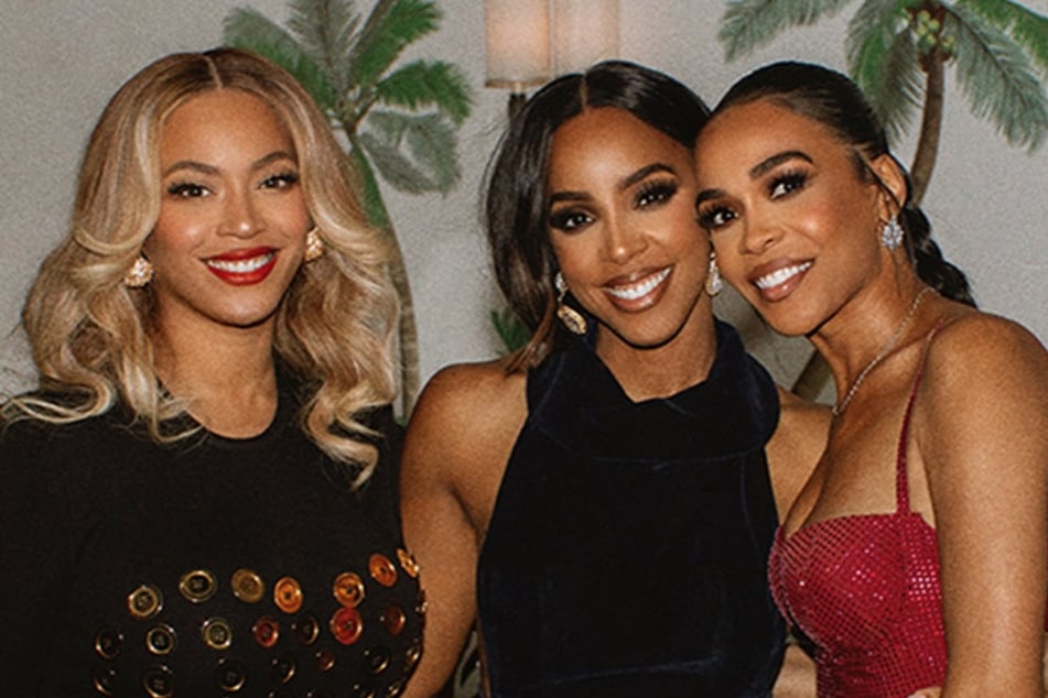 Beyoncé (l.) dropped footage from Kelly Rowland's (c.) birthday party, potentially teasing a reunion with Destiny's Child reunion.