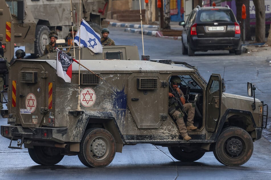 An Israeli soldier sits in his vehicle during a raid in Nablus on July 26, 2026.